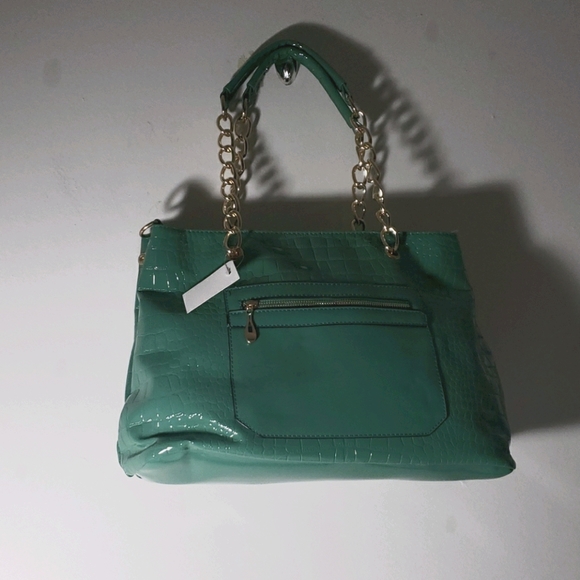 Handbags - Luxcel large bag with lots of pockets.